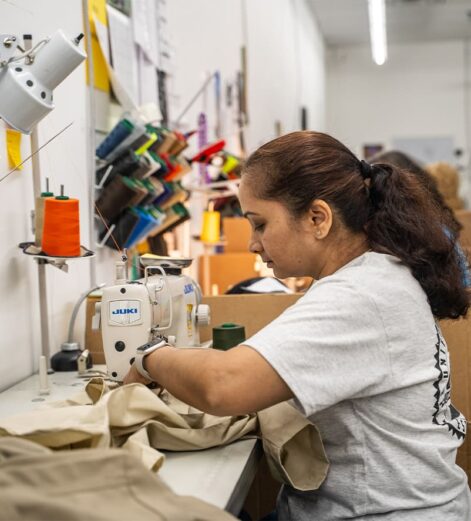 Woman operating a sewing machine